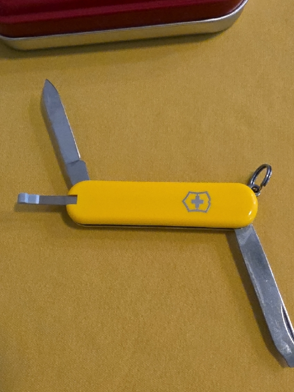 Swiss Army 55 MM Yellow Knife Keychain with Red Metal Tin - Marked Atlantic CAT
